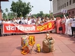 Opposition MPs protest alleged theft of Ram Temple donations at Parliament complex. 