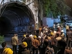 People gather after a landslide in an under-construction tunnel of the Vishnugad-Pipalkoti Hydroelectric Project, in Chamoli district, Uttarakhand, Thursday, Aug. 13, 2026.