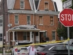 Investigators search a home in the Olney section of Philadelphia, Friday, June 26, 2026. (Jessica Griffin/The Philadelphia Inquirer via AP)