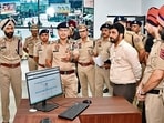 Punjab DGP Gaurav Yadav interacting with police personnel at the integrated command and control centre on Wednesday. (HT PHOTO)