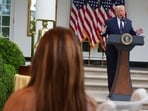 President Donald Trump speaks as Nicki Minaj listens at a lunch in the White House Rose Garden.(AP Photo/Julia Demaree Nikhinson)