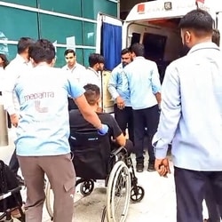 Medical personnel with injured passengers in wheelchairs after the Air India flight (AI2379) from Phuket to Delhi experienced brief in-flight turbulence.