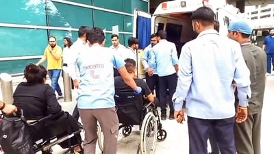 Medical personnel with injured passengers in wheelchairs after the Air India flight (AI2379) from Phuket to Delhi experienced brief in-flight turbulence. (ANI Video Grab) Medical personnel with injured passengers in wheelchairs after the Air India flight (AI2379) from Phuket to Delhi experienced brief in-flight turbulence. (ANI Video Grab)
