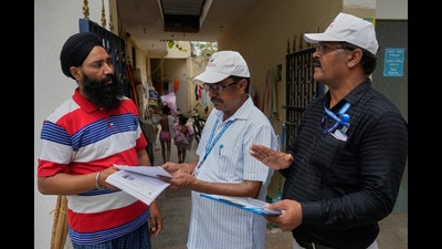 Booth Level Officers (BLO) from the Election Commission verifying and explaining the process of Special Intensive Revision (SIR). (AP Photo/Manish Swarup) Booth Level Officers (BLO) from the Election Commission verifying and explaining the process of Special Intensive Revision (SIR). (AP Photo/Manish Swarup)
