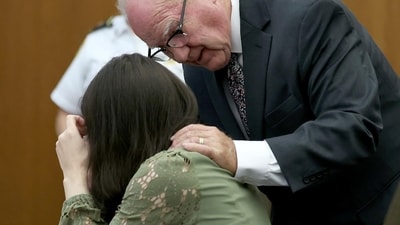 Defense attorney Kevin Reddington consoles his client, Lindsay Clancy, as she sobs during her murder trial at Plymouth Superior Court in Plymouth, Mass., Wednesday, Aug. 12, 2026. (Mark Stockwell/Boston Herald via AP, Pool) (Mark Stockwell/Pool The Boston H) Defense attorney Kevin Reddington consoles his client, Lindsay Clancy, as she sobs during her murder trial at Plymouth Superior Court in Plymouth, Mass., Wednesday, Aug. 12, 2026. (Mark Stockwell/Boston Herald via AP, Pool) (Mark Stockwell/Pool The Boston H)