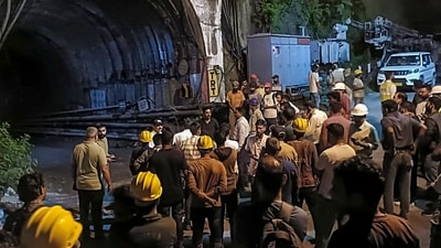 People gather after a landslide in an under-construction tunnel of the Vishnugad-Pipalkoti Hydroelectric Project, in Chamoli district, Uttarakhand, Thursday, Aug. 13, 2026. (PTI) People gather after a landslide in an under-construction tunnel of the Vishnugad-Pipalkoti Hydroelectric Project, in Chamoli district, Uttarakhand, Thursday, Aug. 13, 2026. (PTI)