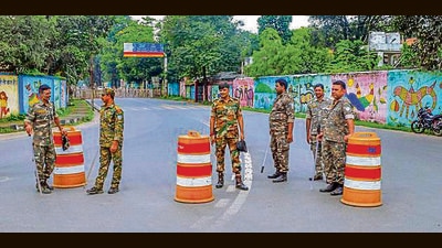 Security personnel stand guard near a road blocked amid security concerns near Jharkhand CM Hemant Soren's residence, in Ranchi, Thursday (PTI) Security personnel stand guard near a road blocked amid security concerns near Jharkhand CM Hemant Soren's residence, in Ranchi, Thursday (PTI)