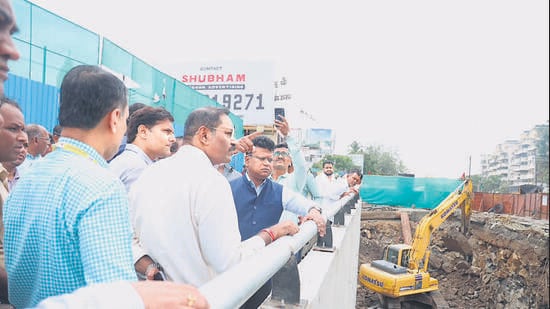 PMC chief Naval Kishore Ram (in blue) inspected Vishrantwadi flyover site (above) on Thursday and set December 2026 as deadline. He also visited proposed Shastrinagar flyover site and set March 2027 as deadline for completion. (HT)