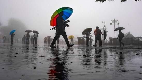Shimla: People move along the road amid monsoon rain, in Shimla, Himachal Pradesh, Tuesday, Aug. 11, 2026. (PTI)