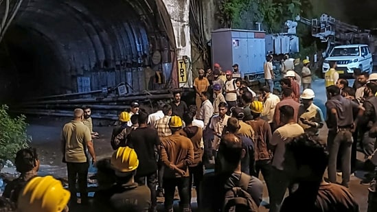 People gather after a landslide in an under-construction tunnel of the Vishnugad-Pipalkoti Hydroelectric Project, in Chamoli district, Uttarakhand, Thursday, Aug. 13, 2026.