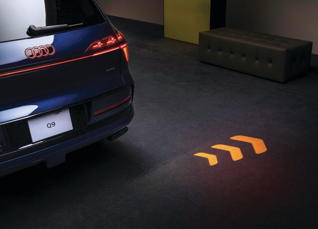 The indicators beam directional arrows onto the tarmac at night. The indicators beam directional arrows onto the tarmac at night.