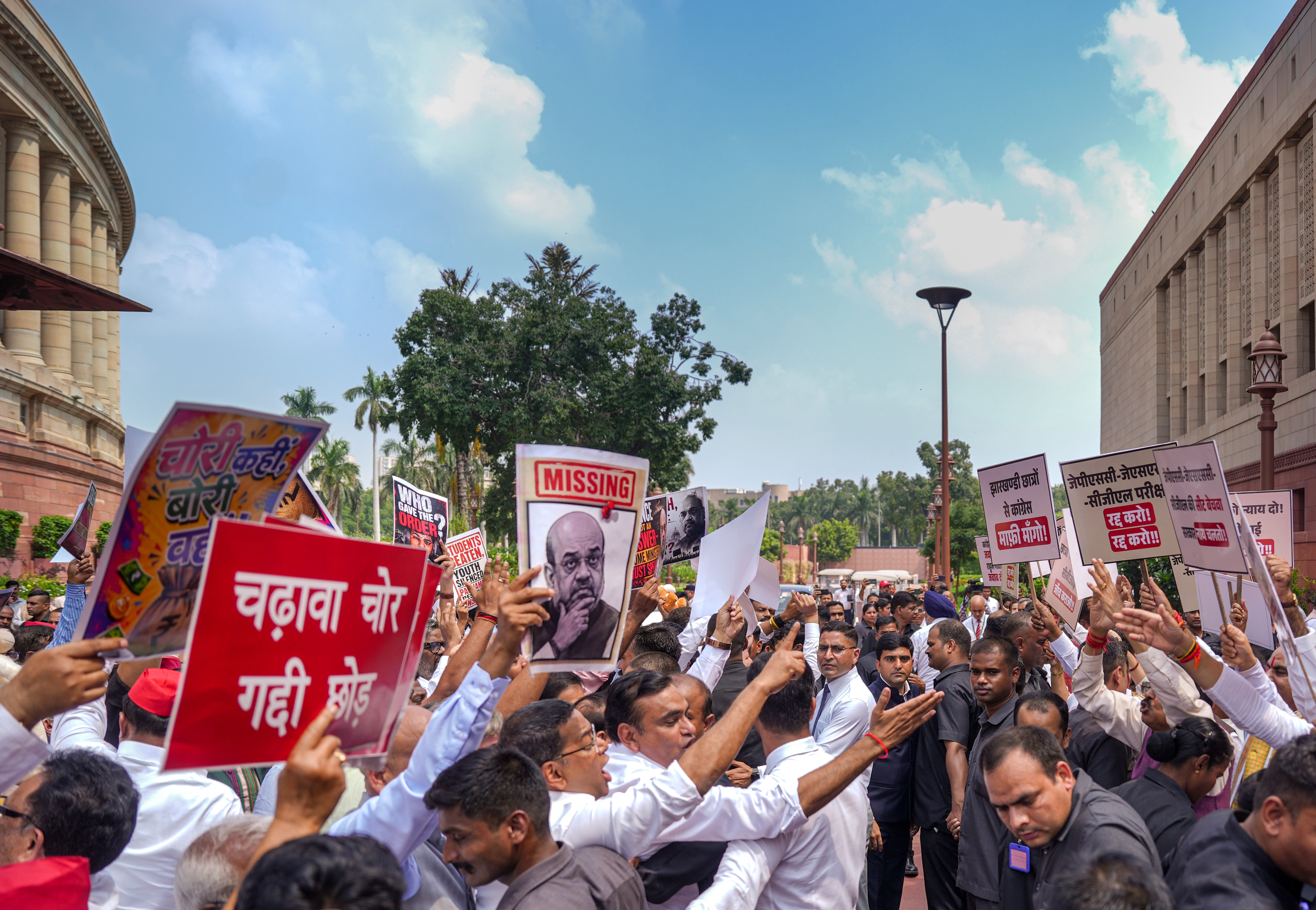 Ruling NDA MPs and opposition MPs stage separate protests during the Monsoon session of Parliament on August 13. (PTI) Ruling NDA MPs and opposition MPs stage separate protests during the Monsoon session of Parliament on August 13. (PTI)