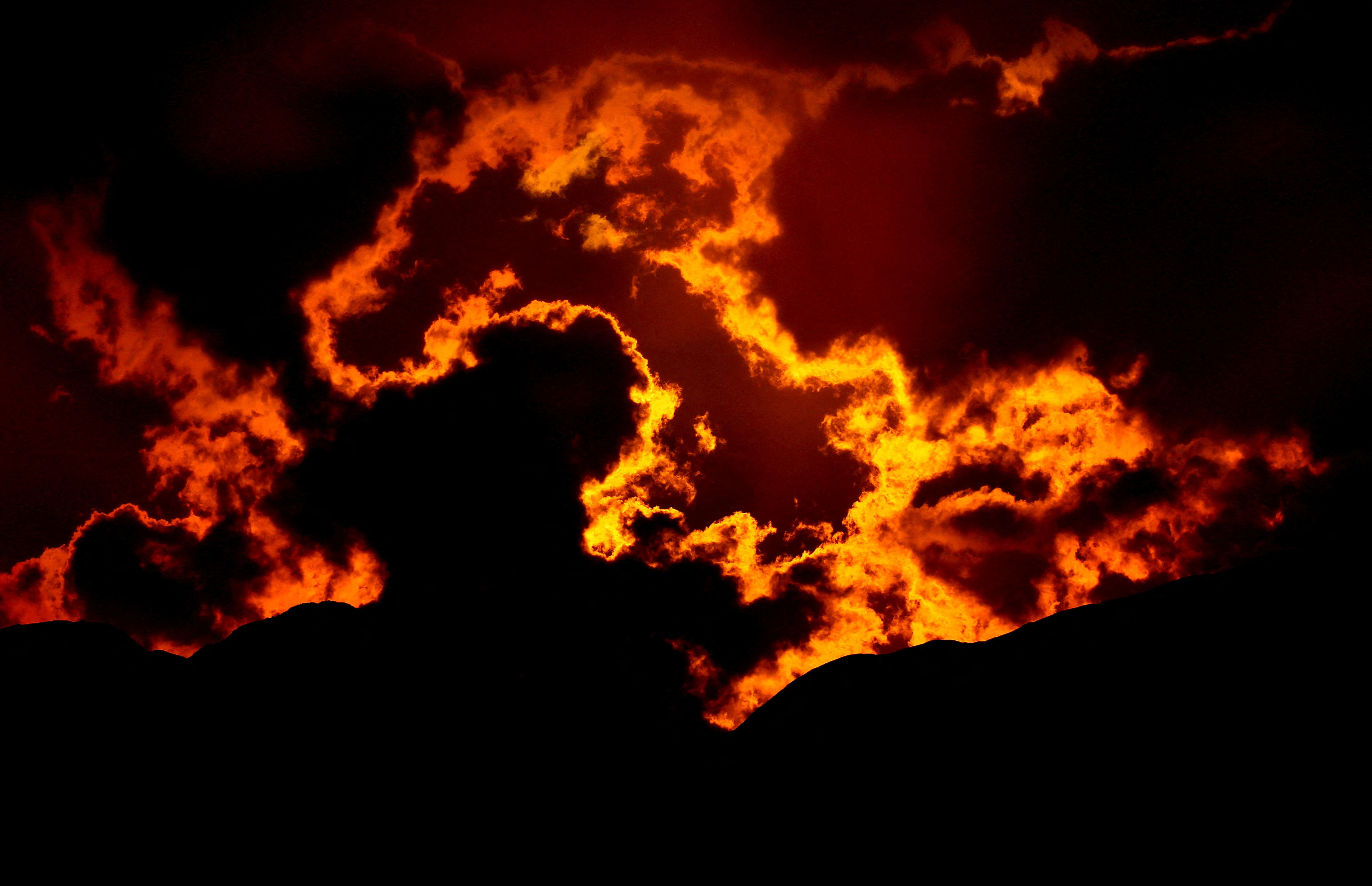 Clouds cover the solar eclipse, seen from the top of Penegal Mountain near Kaltern, South Tyrol, Italy. (Reuters Photo)