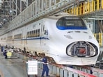 Workers maintain a high-speed train at Nantong High-Speed Train Depot in Nantong, China's eastern Jiangsu province on June 29, 2026.