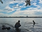 People at a bathing ghat along the Hooghly River in Kolkata. (Sudipta Das/NurPhoto via Getty Images)