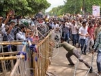 Ranchi: Security personnel stand guard as people march towards Jharkhand Assembly amid a protest over alleged irregularities in the 14th JPSC examination, JSSC-CGL and other recruitment tests.