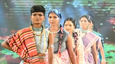 Surrendered women naxals walk on the ramp during a participation in a Tribal fashion show programme organised to mark National Handloom Day, in Raipur on Monday. (ANI Photo) (ANI Photo)