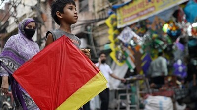 A child carries a kite across a market in the old quarters of Delhi on August 11, 2026. (AFP) A child carries a kite across a market in the old quarters of Delhi on August 11, 2026. (AFP)