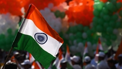 A volunteer holds an Indian national flag during a tricolour campaign in Kolkata on August 10, 2026 ahead of country's 80th Independence Day on August 15. (AFP) A volunteer holds an Indian national flag during a tricolour campaign in Kolkata on August 10, 2026 ahead of country's 80th Independence Day on August 15. (AFP)