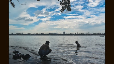 People at a bathing ghat along the Hooghly River in Kolkata. (Sudipta Das/NurPhoto via Getty Images)