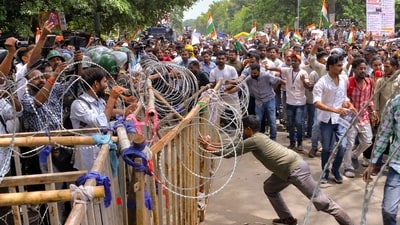 Ranchi: Security personnel stand guard as people march towards Jharkhand Assembly amid a protest over alleged irregularities in the 14th JPSC examination, JSSC-CGL and other recruitment tests. (PTI) Ranchi: Security personnel stand guard as people march towards Jharkhand Assembly amid a protest over alleged irregularities in the 14th JPSC examination, JSSC-CGL and other recruitment tests. (PTI)