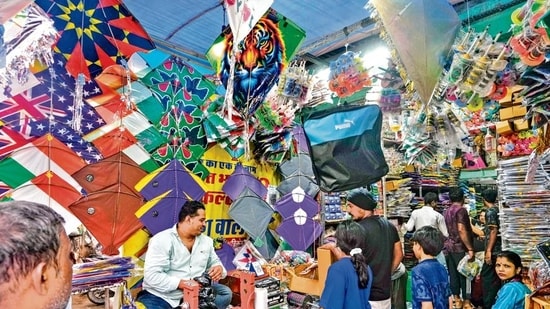 Shoppers throng the vibrant aisles of Lal Kuan to eagerly pick out their favourite colourful kites for flying.