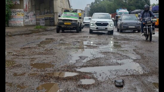 Damaged road conditions in Sherpur area in Ludhiana on Friday. (Gurpreet Singh/Hindustan Times)