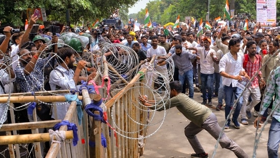 Ranchi: Security personnel stand guard as people march towards Jharkhand Assembly amid a protest over alleged irregularities in the 14th JPSC examination, JSSC-CGL and other recruitment tests. (PTI)