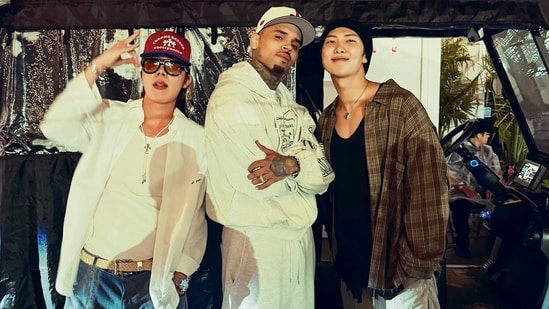 BTS Members RM and J-Hope shared a photo with Chris Brown