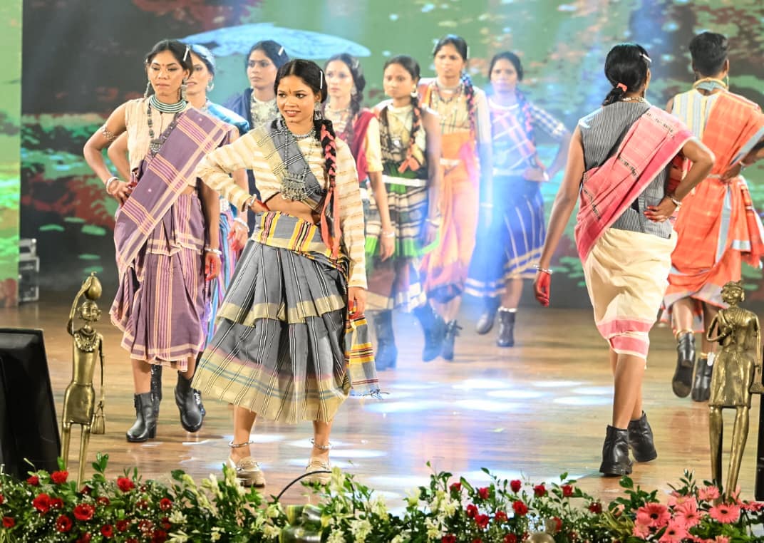 Raipur, Aug 10 (ANI): Surrendered women naxals walk on the ramp during a participation in a Tribal fashion show programme organised to mark National Handloom Day, in Raipur on Monday. (ANI Photo) (ANI Photo)