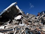 Colombia Earthquake: Rescuers look for survivors amid the rubble of a collapsed building after an earthquake in Pereira,