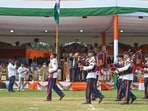 Haryana Deputy Speaker Dr Krishan Lal Middha takes the salute of the parade during the 80th Independence Day celebrations at Tau Devi Lal Stadium on Saturday. (Parveen Kumar/HT)