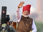 Narendra Modi, India's prime minister, waves to the crowds during the nation's Independence Day ceremony at the Red Fort in New Delhi, 