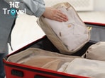 Packing cubes went from unnecessary extras to my suitcase essentials, keeping outfits organised and two children’s clothes properly separated. (canva.com)