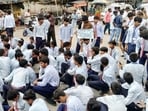 Police pacified the students and moved them from the road back to the school premises. 