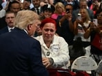 US President Donald Trump leaves stage to hug Jacob Freytes grieving parents.