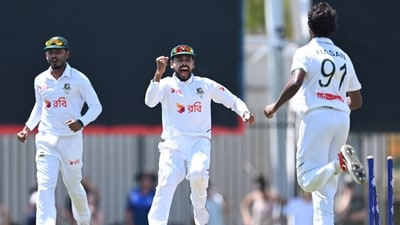 Mehidy Hasan Miraz (centre) celebrates the wicket of an Aussie batsman with his bowler. (James Ross/JAMES ROSS/AAP via AP) Mehidy Hasan Miraz (centre) celebrates the wicket of an Aussie batsman with his bowler. (James Ross/JAMES ROSS/AAP via AP)
