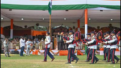 Haryana Deputy Speaker Dr Krishan Lal Middha takes the salute of the parade during the 80th Independence Day celebrations at Tau Devi Lal Stadium on Saturday. (Parveen Kumar/HT)