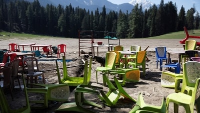 Chairs and tables scattered at the site of the terrorist attack on tourists in Baisaran near Pahalgam in south Kashmir's Anantnag district, last year. (Reuters file)