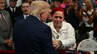 US President Donald Trump leaves stage to hug Jacob Freytes grieving parents. (AFP) US President Donald Trump leaves stage to hug Jacob Freytes grieving parents. (AFP)
