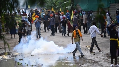 Chandigarh Police use tear gas and water cannons to disperse the protesters belonging to the Quami Insaaf Morcha. ( Ravi Kumar/HT photo)