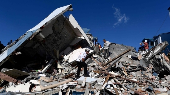 Colombia Earthquake: Rescuers look for survivors amid the rubble of a collapsed building after an earthquake in Pereira, (AFP)