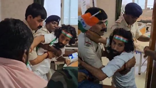Jharkhand student leader Devendra Nath Mahto scuffles with police as he tries to leave the Sadar hospital in Ranchi on Independence Day.