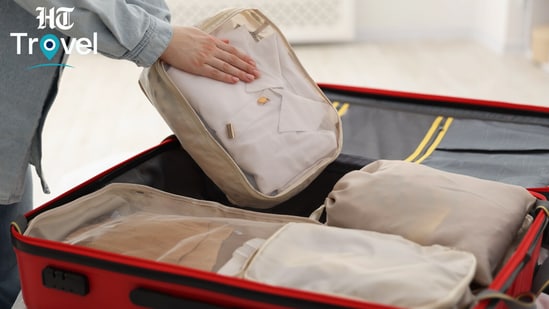 Packing cubes went from unnecessary extras to my suitcase essentials, keeping outfits organised and two children’s clothes properly separated. (canva.com)