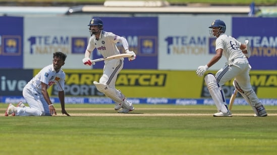 Yashasvi Jaiswal, right, and KL Rahul run towards the same end as Keshara Nuwantha watches during the day one of the first Test match in Galle