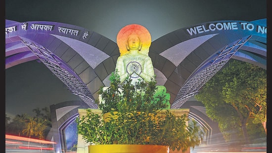 The Noida Gate illuminated with the colours of the national flag in celebration of the 80th Independence Day. (Sunil Ghosh/HT)