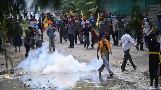 Chandigarh Police use tear gas and water cannons to disperse the protesters belonging to the Quami Insaaf Morcha.