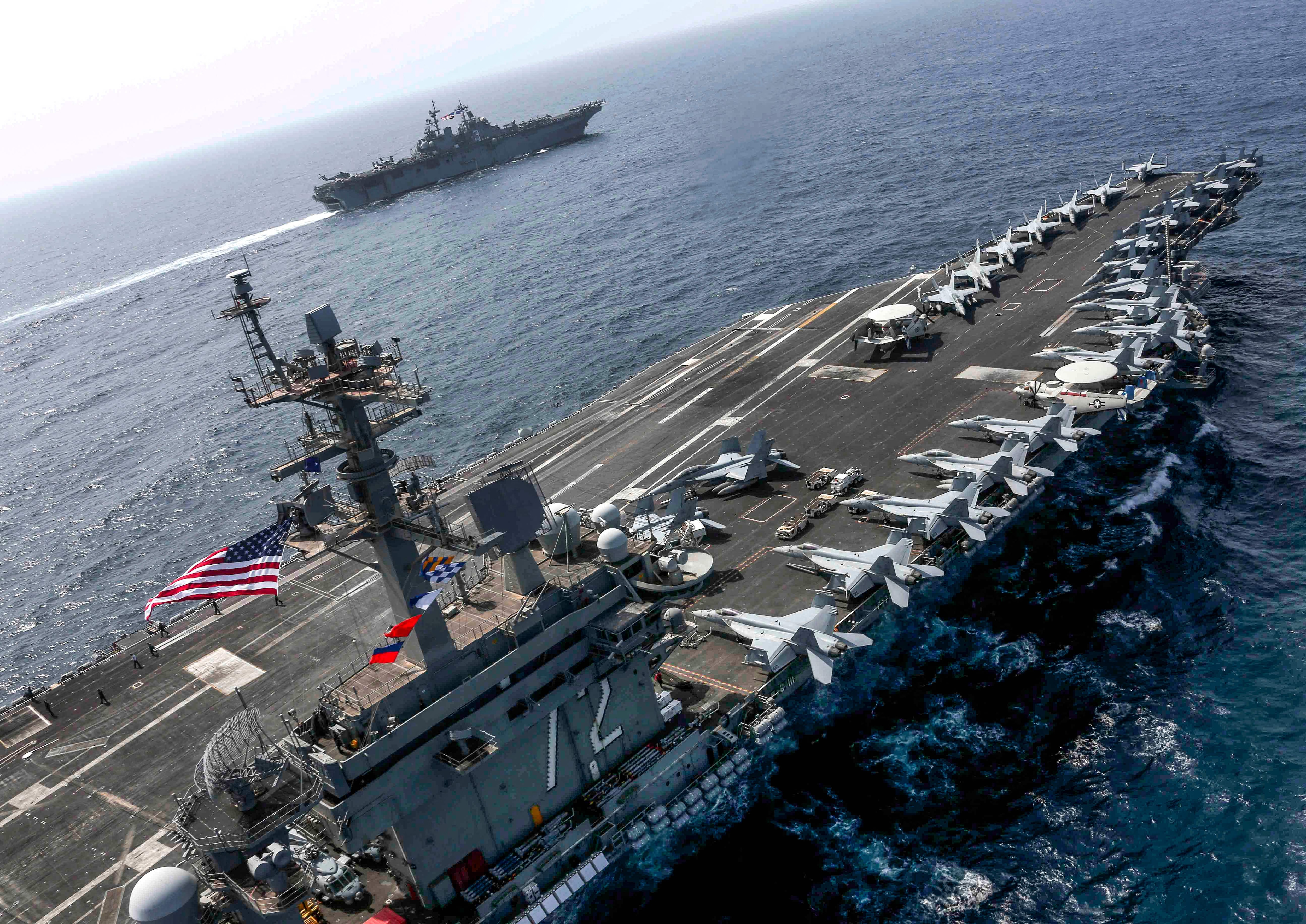 US Navy photo shows USS Abraham Lincoln and USS Kearsarge conducting joint operations in the Arabian Sea. (via AFP) US Navy photo shows USS Abraham Lincoln and USS Kearsarge conducting joint operations in the Arabian Sea. (via AFP)