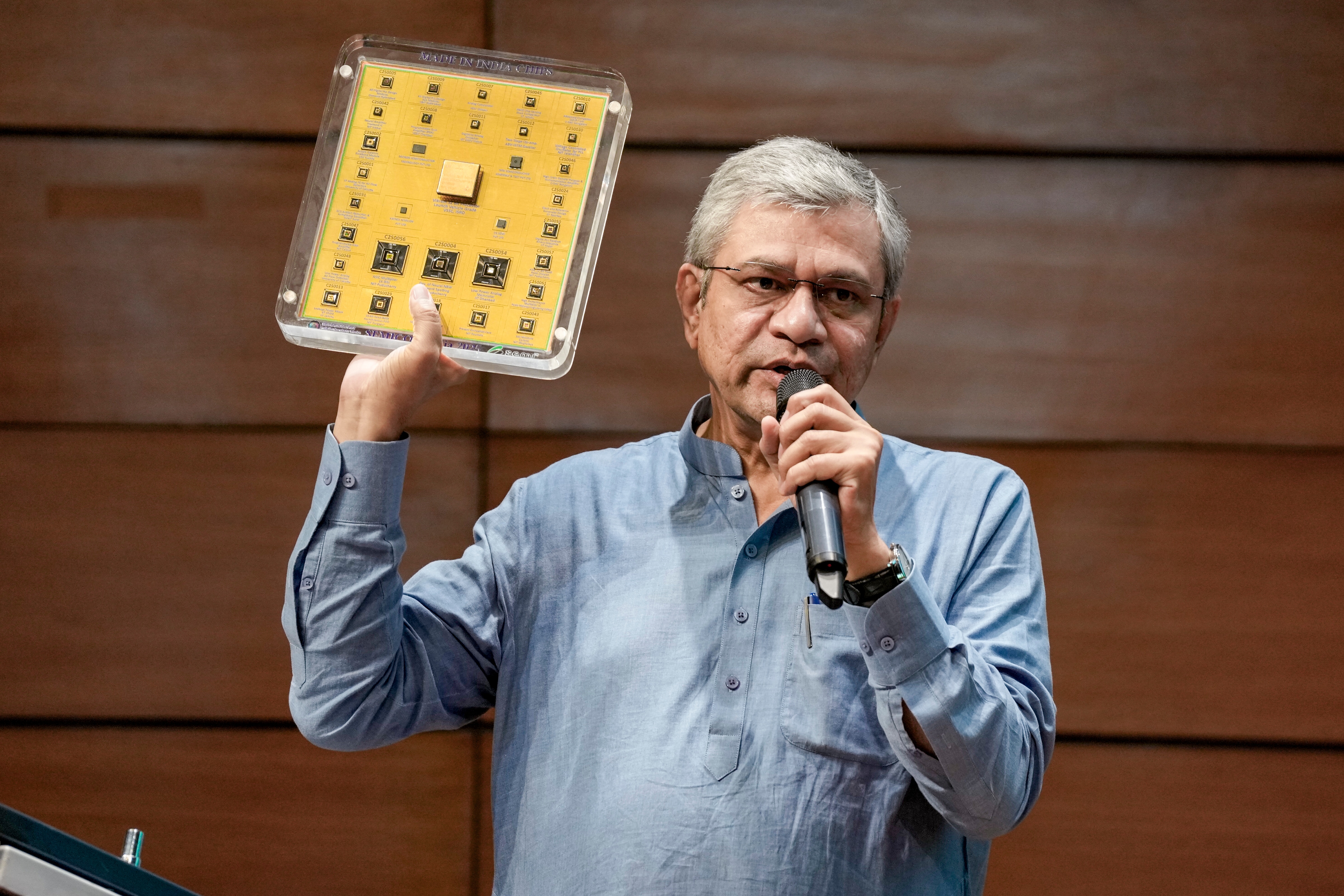Union Information and Broadcasting Minister Ashwini Vaishnaw showcases 'Made in India' semiconductor chips as he speaks during a cabinet briefing, in New Delhi, July 15, 2026. (PTI) Union Information and Broadcasting Minister Ashwini Vaishnaw showcases 'Made in India' semiconductor chips as he speaks during a cabinet briefing, in New Delhi, July 15, 2026. (PTI)