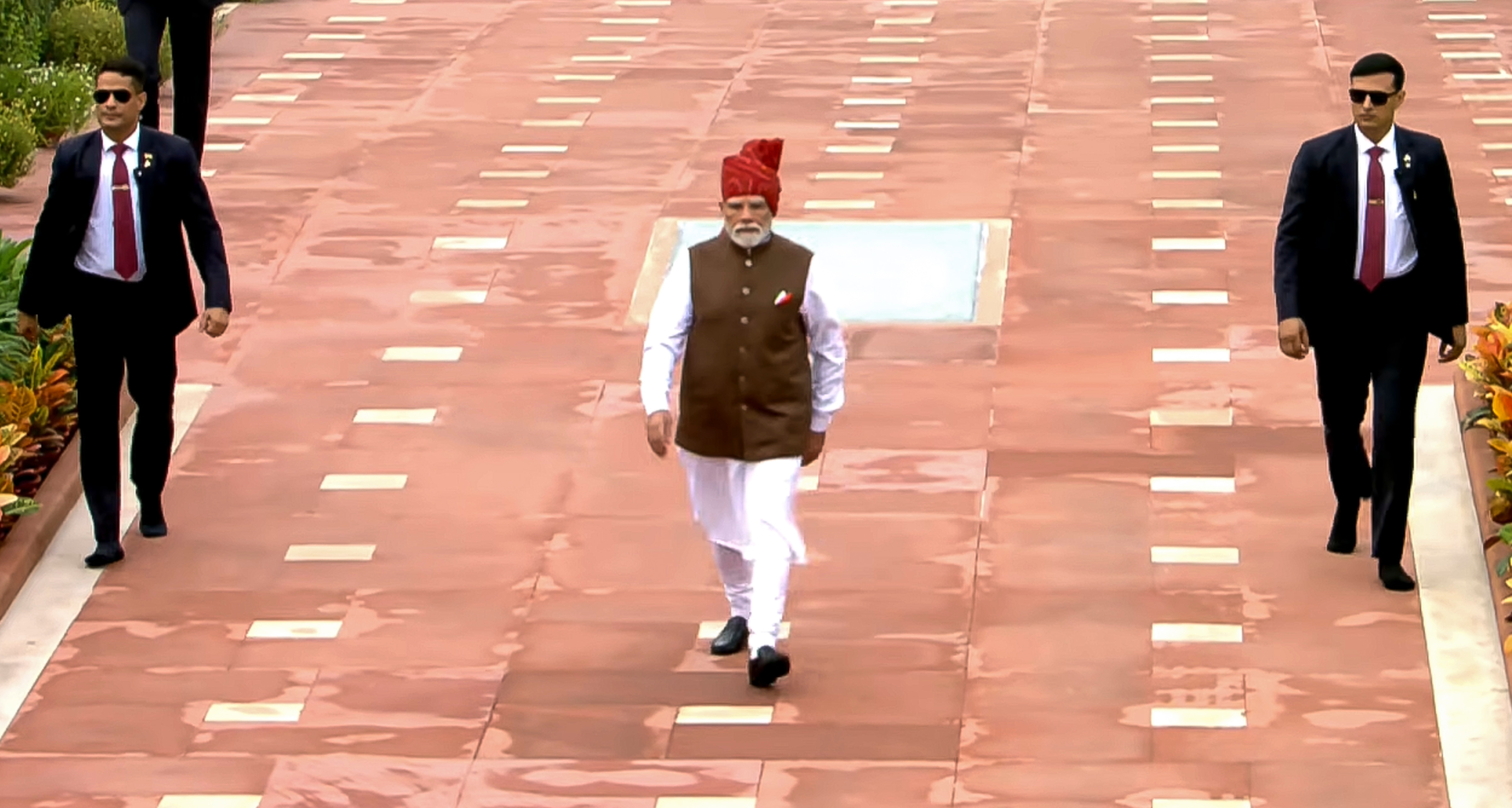 Prime Minister Narendra Modi arrives to pay homage at Rajghat during the 8oth Independence Day, in New Delhi. (@narendramodi/YT via PTI Photo) Prime Minister Narendra Modi arrives to pay homage at Rajghat during the 8oth Independence Day, in New Delhi. (@narendramodi/YT via PTI Photo)